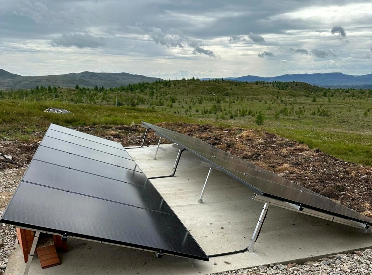 Domestic ground-mounted solar array in Highland landscape